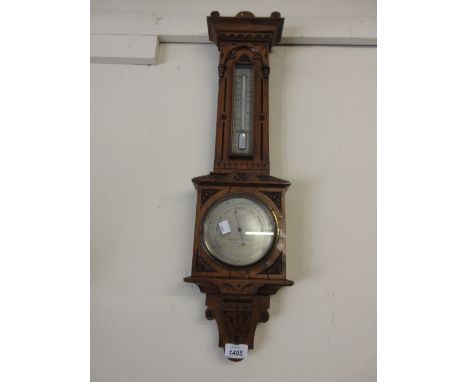 Negretti and Zambra aneroid barometer / thermometer in ornate carved oak case with silvered dials