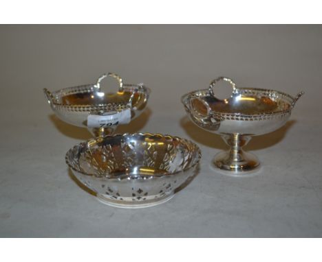 Pair of Birmingham silver three handled pedestal bonbon dishes, together with a circular pierced silver trinket dish