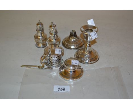 Small silver capstan inkwell, pair of silver peppers and a mustard, pair of silver dwarf candlesticks (one a/f)