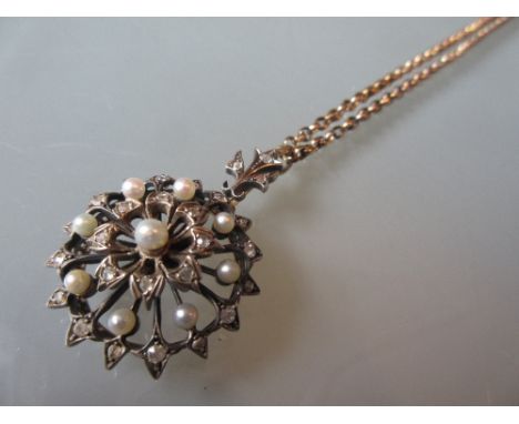19th Century yellow metal pearl and rose cut diamond set pendant of circular floral design on an associated antique chain