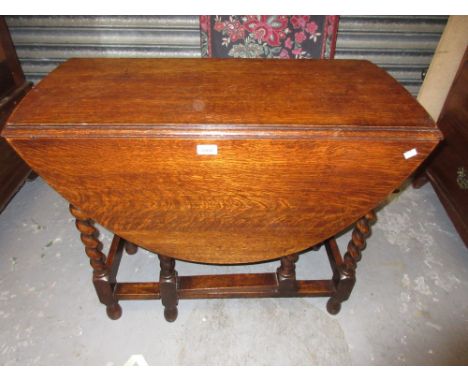 Early 20th Century oak oval gate leg table on barley twist supports