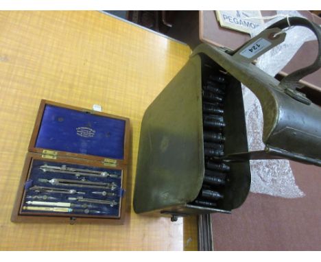 Metal ammunition case with leather handle and a mahogany cased drawing instrument set