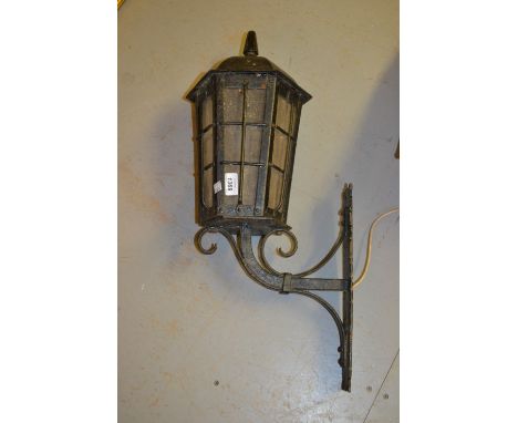 Black painted wrought iron lantern together with a brass mounted glass table lamp and a plated condiment set