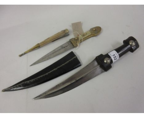 Dagger with horn handle with leather sheath and a brass and horn mounted dagger with wooden and brass scabbard