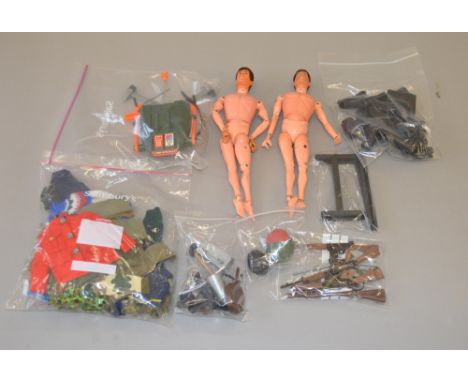 Quantity of assorted Action Man accessories, including clothing and weapons, together with two Action Man figures. Overall G.