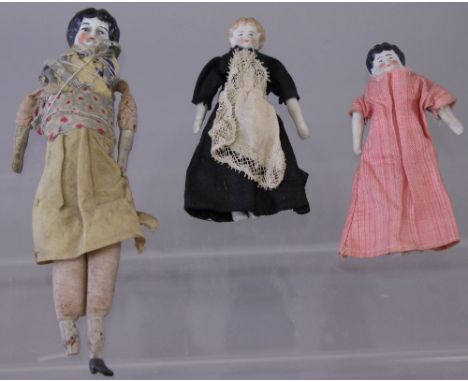 Selection of glazed china shoulder-head dolls, with molded hair, cloth bodies, bisque forearms and lower legs (one with foot 