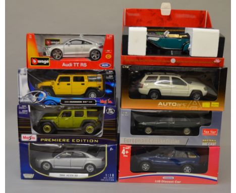 Eight assorted 1:18 scale diecast model vehicles including: Burago Audi TT RS; Motor Max 2004 Audi A8; Sun Star Audi Quattro 