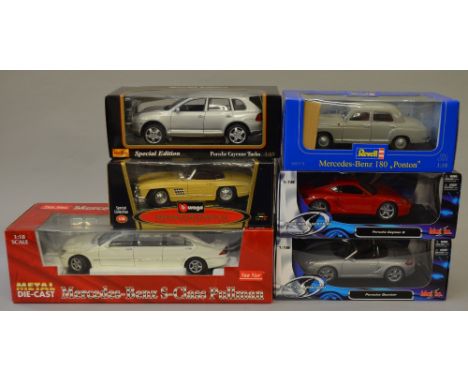 Three 1:18 scale  Maisto diecast model vehicles including:  Porsche Cayman S; Boxster; Cayenne Turbo. together with  Revell M