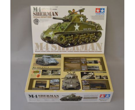 Tamiya 1/16th scale Radio controlled M4 Sherman Howitzer. ref 56104 appears VGB