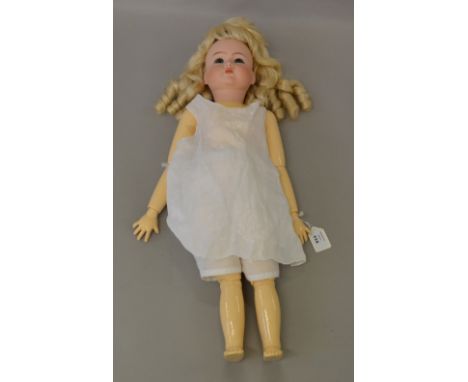 A Simon and Halbige bisque head doll with jointed wooden body (some restoration).