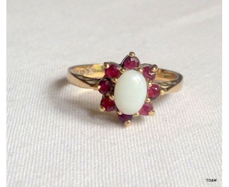 A 9ct gold opal and garnet ring size N