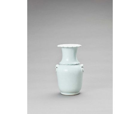   A DEHUA STYLE CELADON-GLAZED VASE, LATE QING  China, 19th to early 20th century. The vase of ovoid form with a lobed cylind