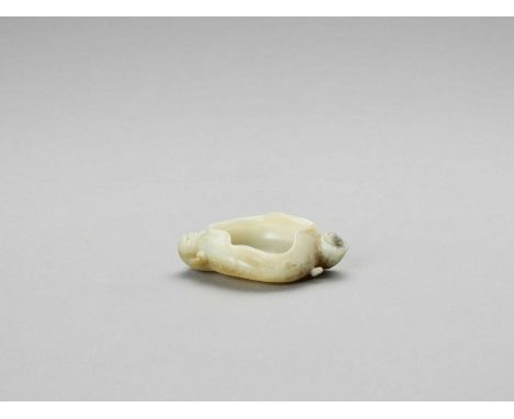   A JADE ‘LOTUS’ BRUSH WASHER  China, Qing dynasty (1644 – 1912). The translucent stone of a fine celadon color carved as a s