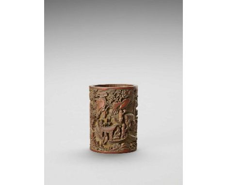   A CARVED BAMBOO BITONG BRUSHPOT, 20th CENTURY  China. Carved with figures in a landscape with rocks and pines and some call