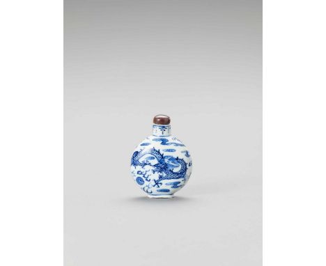   A BLUE AND WHITE PORCELAIN 'DRAGON' SNUFF BOTTLE  China, 18th – 19th century. The flattened globular shaped bottle is paint