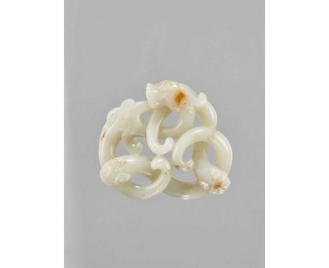   A LARGE CELADON JADE CARVING OF THREE INTERTWINED DRAGONS, LATE QING TO REPUBLIC  China, late Qing dynasty (1644-1912) to R
