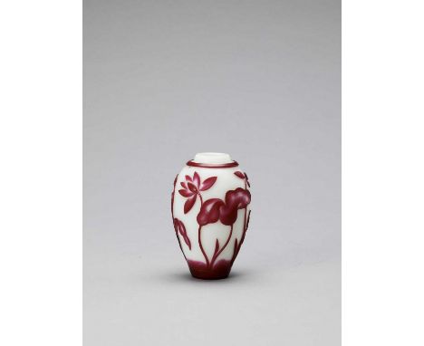   A RUBY RED OVERLAY PEKING GLASS ‘LOTUS’ VASE, QING  China, 1644-1912. The vase with a ruby red overlay on opaque white glas