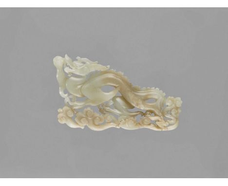   A CELADON JADE ‘DRAGON’ PLAQUE, LATE QING TO REPUBLIC  China, late Qing dynasty (1644-1912) to Republic period (1912-1949).