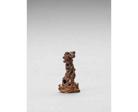   A CARVED AGARWOOD ‘LINGZHI CLOUDS’ JOSS-STICK HOLDER WITH BOXWOOD STAND, QING  China, 1644-1912. The holder finely carved a