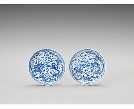   A PAIR OF BLUE AND WHITE PORCELAIN ‘DRAGONS’ DISHES, LATE QING  China, 19th to early 20th century. Each with shallow sides 