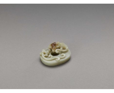   A CELADON AND RUSSET ‘CHILONG AND PHEONIX’ JADE DISC, LATE QING  China, late Qing dynasty (1644-1912). Carved from celadon 