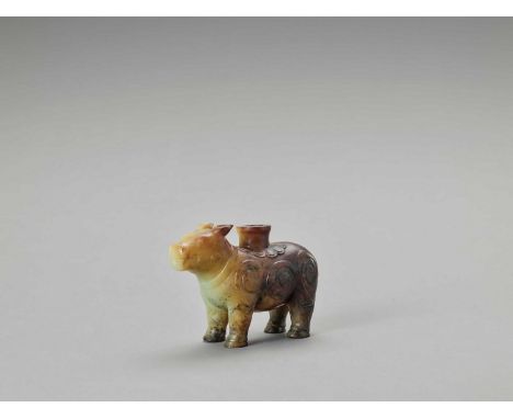   A CELADON AND RUSSET JADE ‘TAPIR’ VESSEL, LATE QING TO REPUBLIC  China, late Qing dynasty (1644-1912) to Republic period (1
