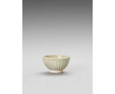   A CELADON CERAMIC BOWL  China, Song dynasty or later. Glazed in a celadon hue, with carved floral decoration on the inside 