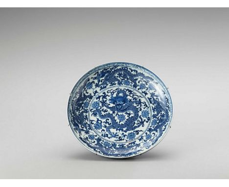  A LARGE BLUE AND WHITE PORCELAIN ‘DRAGON’ CHARGER  China, late Qing to Republic period (1900-1950). With shallow rounded si