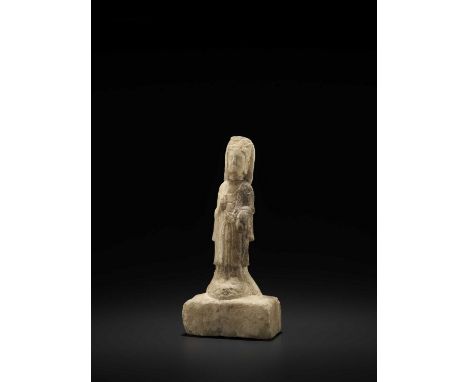   A RARE YELLOW MARBLE FIGURE OF AVALOKITESHVARA, NORTHERN QI DYNASTY  China, 550-577. Elegantly carved in the form of Avalok