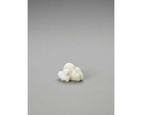   TWO RAMS JADE GROUP  China, Republic period (1930-1949). The near white colored stone carved with a ram and young grasping 