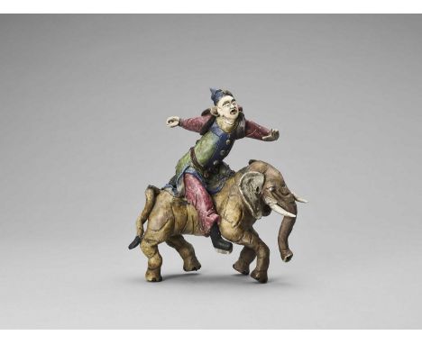   A GLAZED TERRACOTTA FIGURE OF A DIGNITARY RIDING AN ELEPHANT, MID-QING  China, mid-Qing dynasty (1644-1912). The rider and 