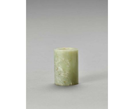   A CELADON JADE CYLINDER, QING  China, 1644-1912. The translucent stone of celadon tone with white and russet inclusions, ca