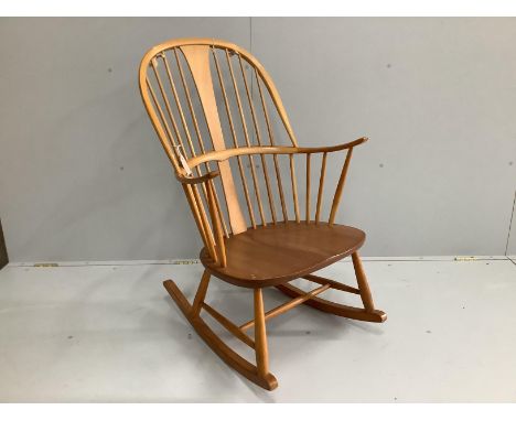 An Ercol elm and beech rocking armchair, width 66cm, depth 46cm, height 106cm