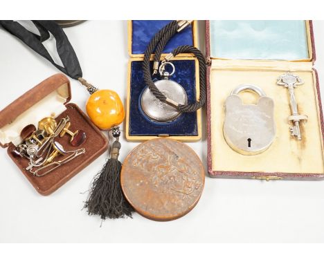 A group of 19th century and later collectibles to include a silver plated presentation padlock and key, a silver hunter pocke