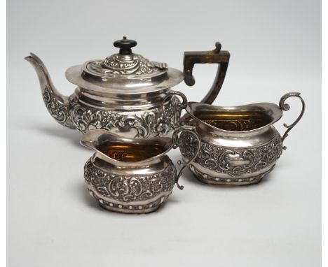 A matched late Victorian silver three piece tea set, maker's Haseler Brothers and John Round &amp; Son Ltd, Birmingham, 1899 