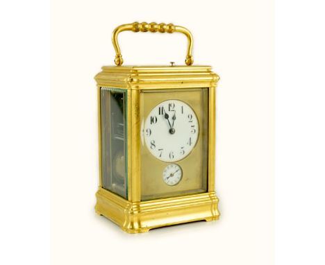 An early 20th century French ormolu Grande Sonnerie alarum clock, with enamelled Arabic dials and gorge case, movement striki