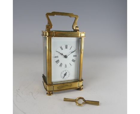 A 20th century French alarm carriage Clock, enamelled white dial with Roman numerals and subsidiaries, movement stamped 'Made
