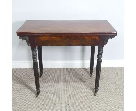 A Regency mahogany card Table, raised on reeded column legs and brass castors, W 91.5 cm x H 74 cm x D 45 cm. 