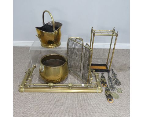 An early 20th century brass Stick Stand, H&nbsp;63 cm, together with a brass fender, coal bucket, large pot, horse brasses et