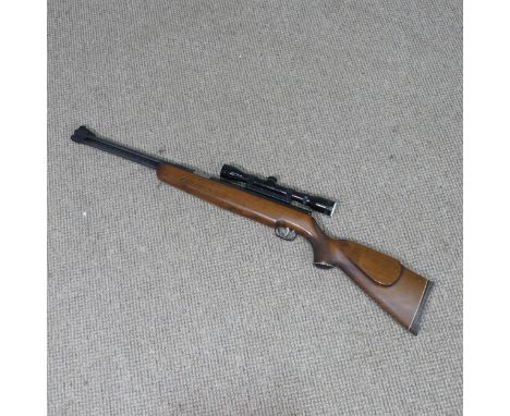 Weihrauch model HW 77 K .22 Air Rifle, with under lever action, beech stock with chequered pistol grip and Bushmaster 4x32 sc