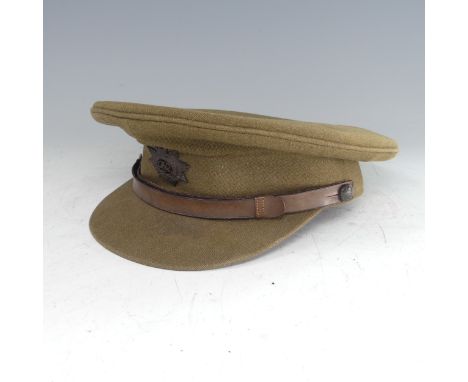 A WW2 painted tin Helmet, repainted, together with Royal Army Service Corps khaki Cap by 'W. Jennings', and two navy officers