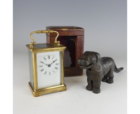 An early 20th century carriage Clock, in fitted leather case, the white enamel dial with Roman numerals, to a bevelled glass 