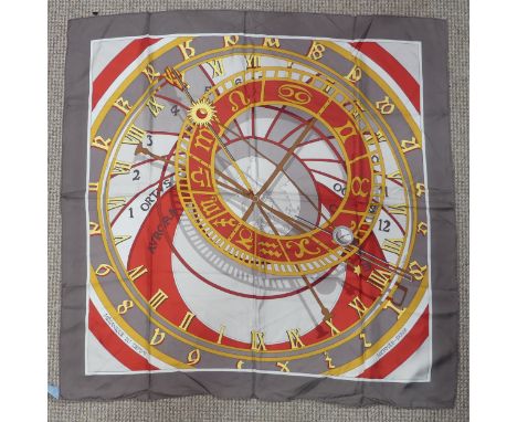 A Hermès&nbsp;silk twill scarf: 'Mecanique du Temps', designed by Loic Dubigeon on taupe ground, hand rolled edges, with fabr