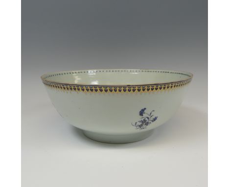 A 19thC Chinese export porcelain Punch Bowl, the rim with gilt and cobalt blue scale decoration, the body with sparse floral 