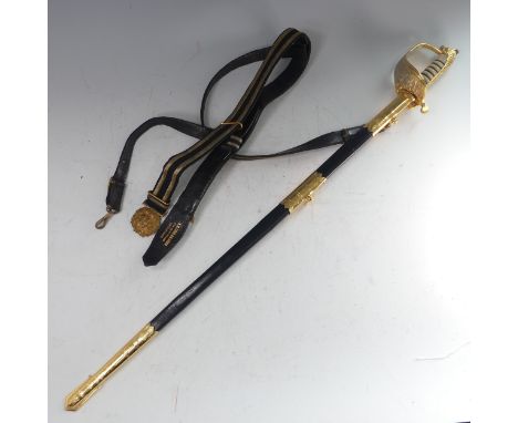 A reproduction 1827 pattern Royal Navy Officers Sword, fullered steel blade etched with insignia, over a brass guard and wire