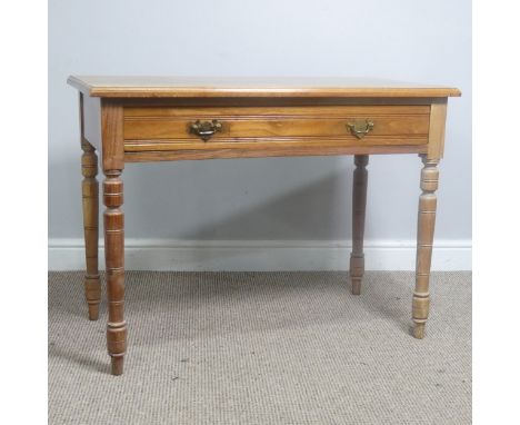 An early 20th century light oak Side Table, with frieze drawer, raise on turned supports, W 92 cm x H 67.5 cm x D 48 cm. 