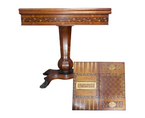 A 19th century Irish Killarney marquetry and yew games Table, hinged rectangular top inlaid with an oval reserve of Muckross 