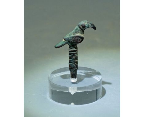A choice bronze finial from Luristan, ca. 800 - 200 BC. This superbly detailed bird is 1-1/2" high and is perched atop an orn