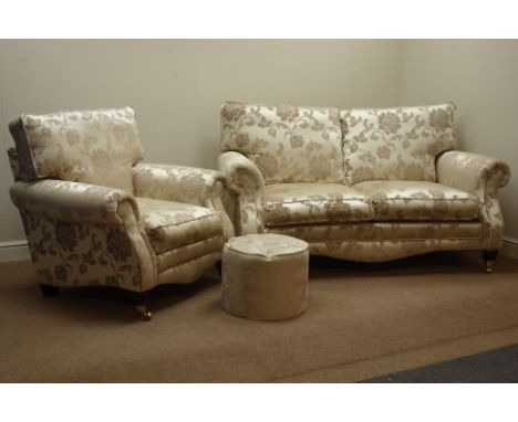 Two seat sofa (W168cm), and matching armchair (W93cm), upholstered in gold fabric, on mahogany finish feet with brass castors