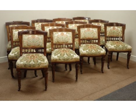 Set twelve Edwardian walnut upholstered chairs, with stepped cresting rail, carved decoration, turned fluted supports, cerami